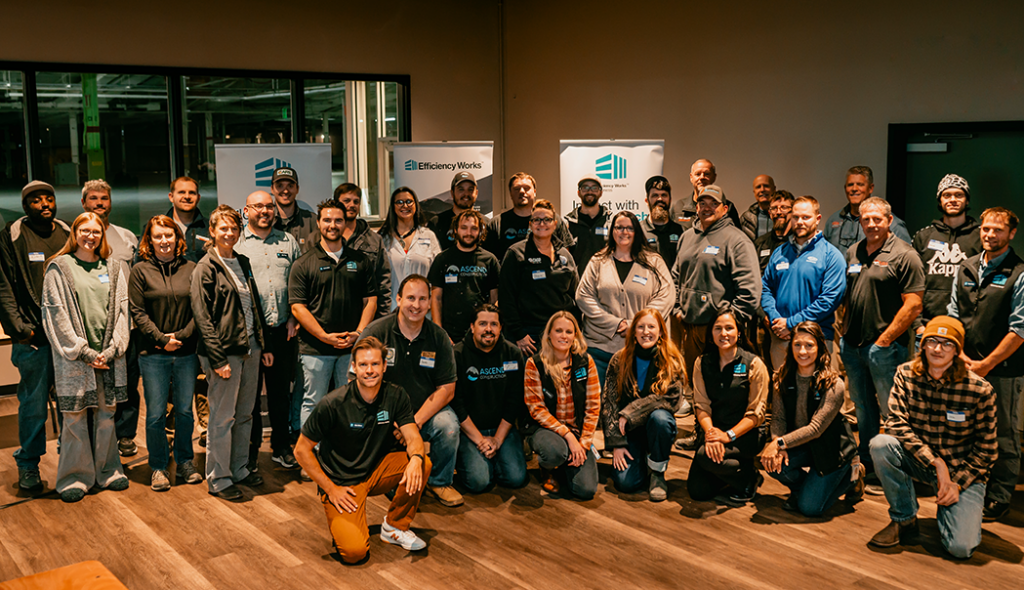 Group of people smiling for a group photo at an event
