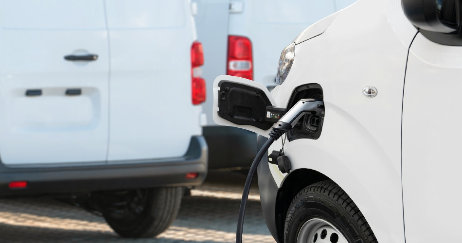 Close up of an EV charger plugged into a white electric vehicle.