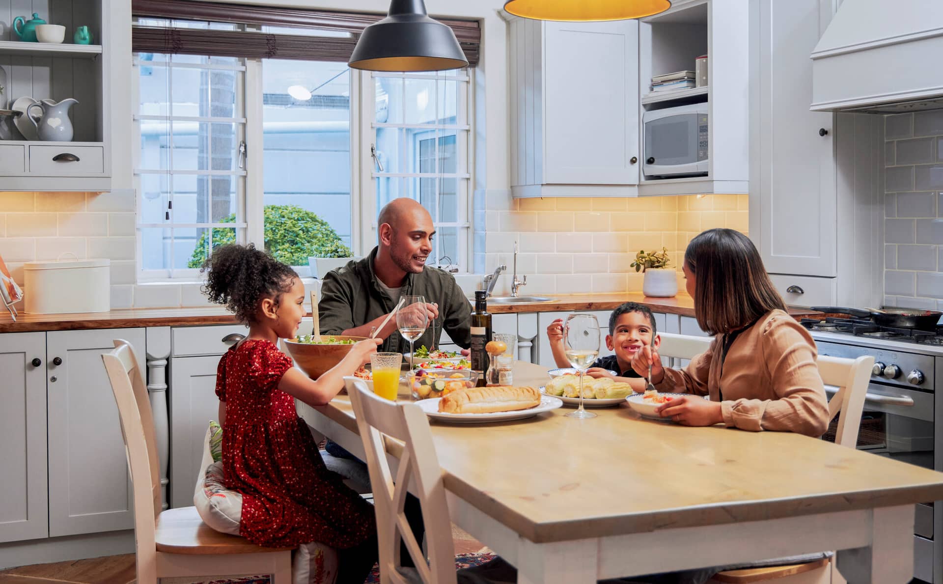 Shot of a young family enjoying a meal together