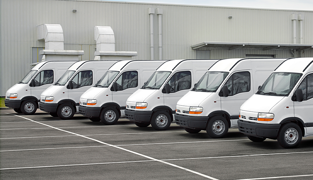 Fleet of white electric vehicle fans in a parking lot
