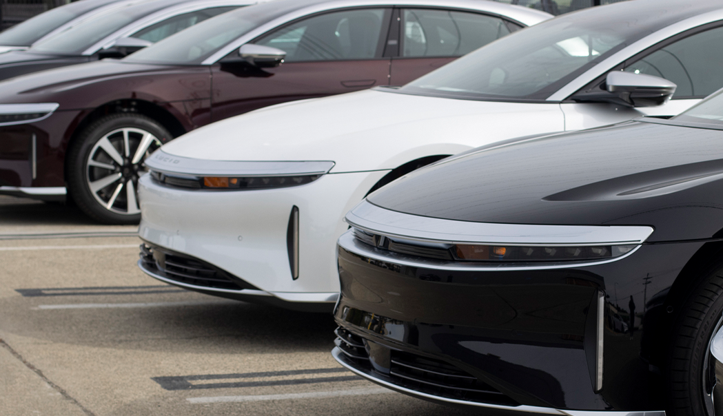 Close up of the front of three electric vehicles lined up against each other